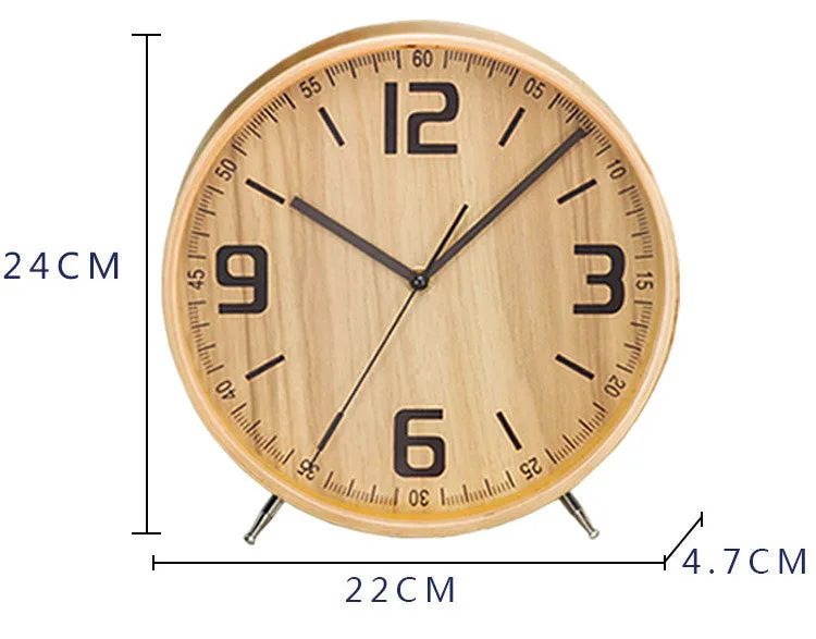 Round wood quartz table clock with sweep second movement in green finish on a wooden surface