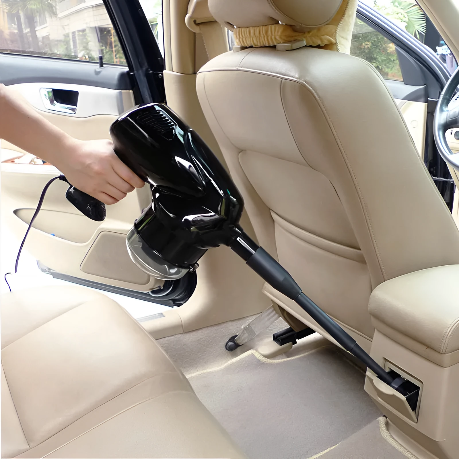 12V 100W hand-held dry wet vacuum cleaner with 6-metre cord and cigarette lighter plug sitting on car seat