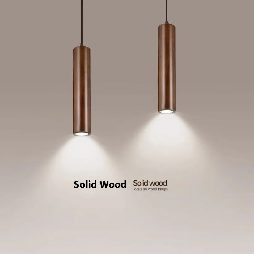 Solid wood Japanese style long chandelier with three warm light droplights in a modern bedroom