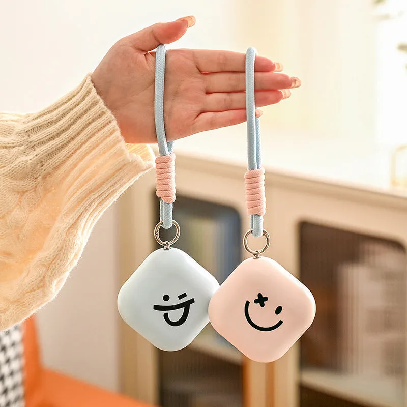 Square rechargeable hand warmer in white, light green, and pink colours with USB charging