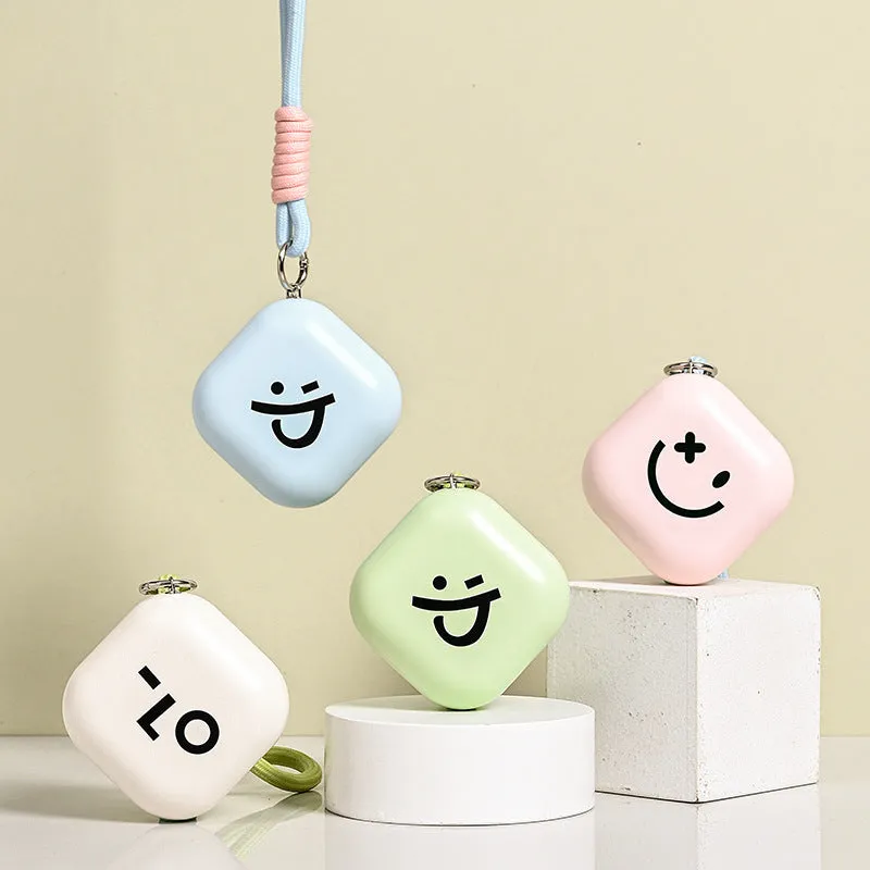 Square rechargeable hand warmer in white, light green, and pink colours with USB charging