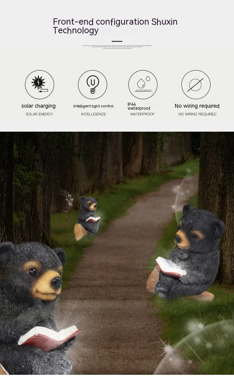 Black bear solar light ornament in synthetic resin placed in garden with solar panel on top