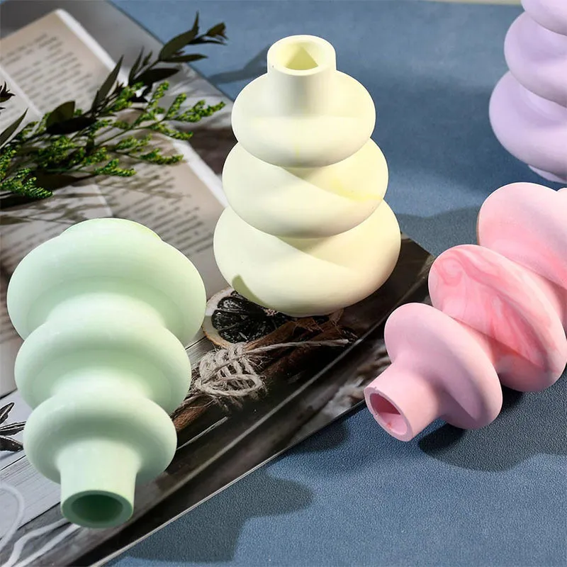 Silicone crafting mould for making three-layer irregular circle vase ornaments in small and large sizes.