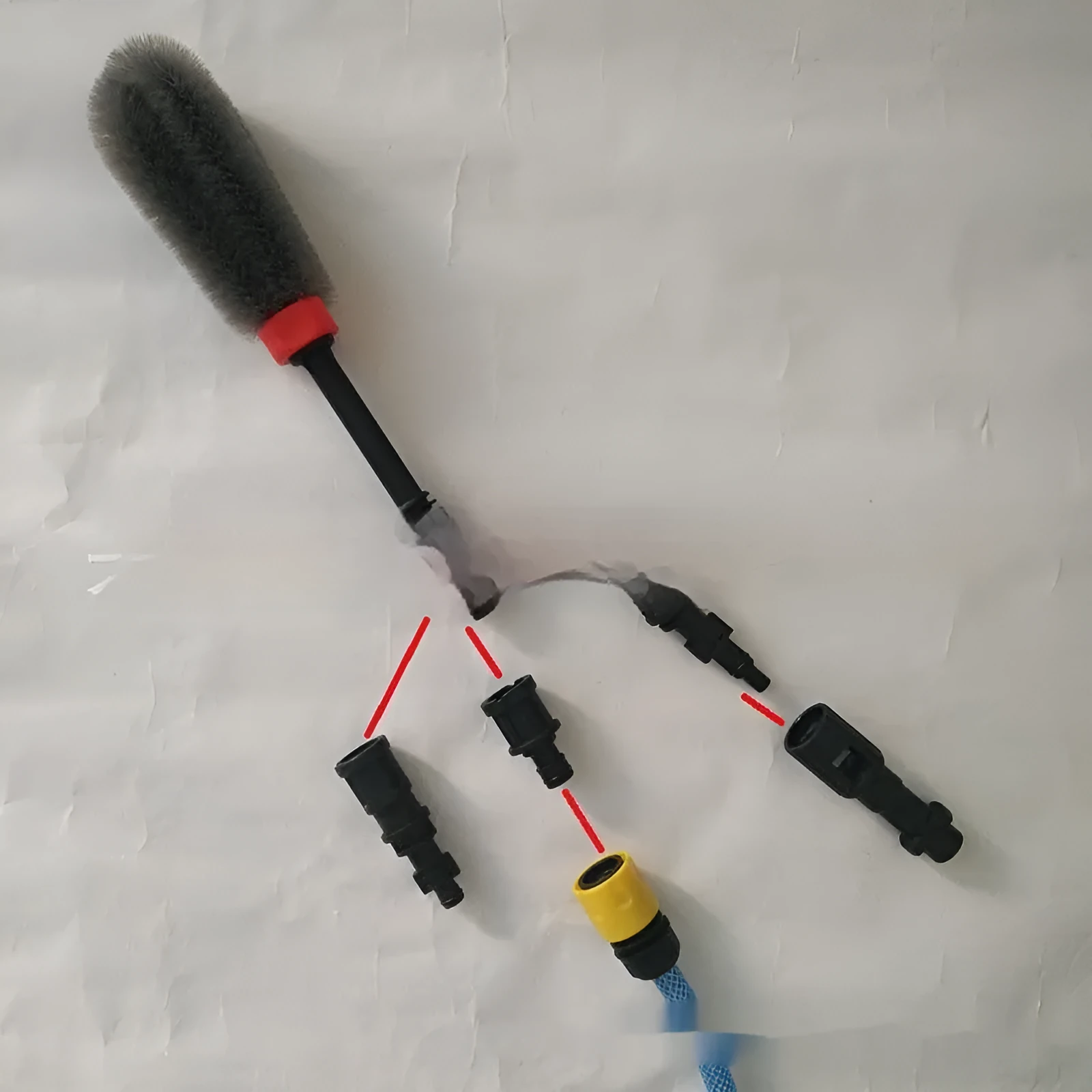 Quick plug high-pressure car wash wheel hub brush with steel wire bristles and flow-through design