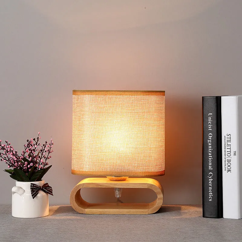 Nordic Japanese bedside table lamp with rubber wood holder, Φ170mm by H230mm, on a nightstand