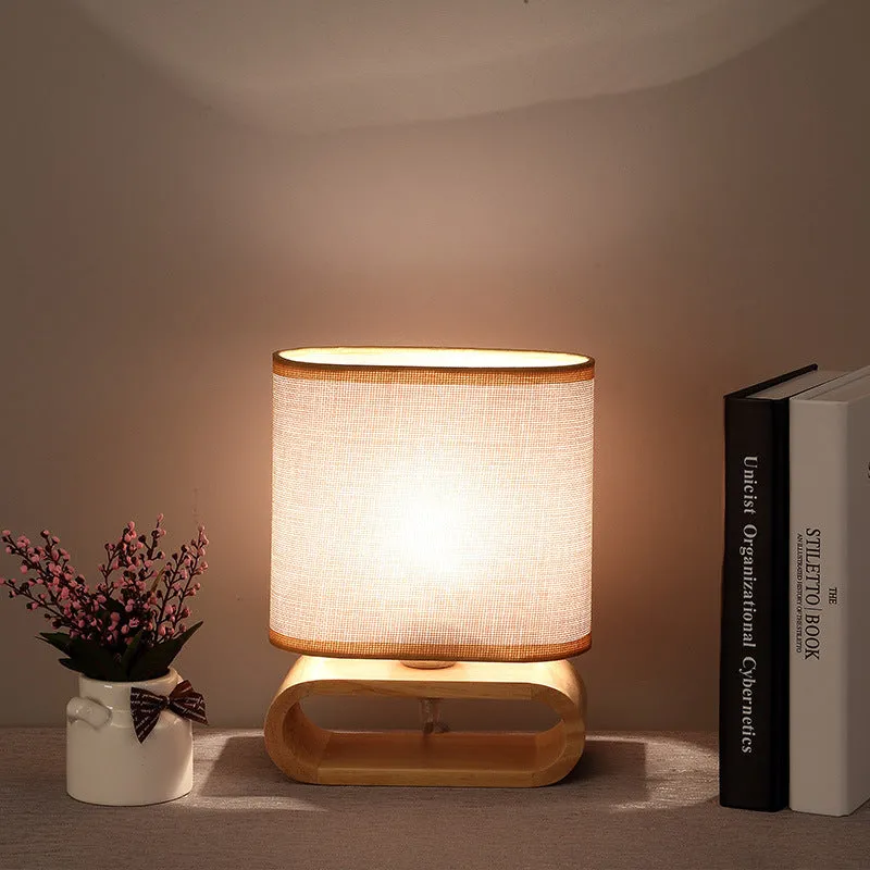 Nordic Japanese bedside table lamp with rubber wood holder, Φ170mm by H230mm, on a nightstand
