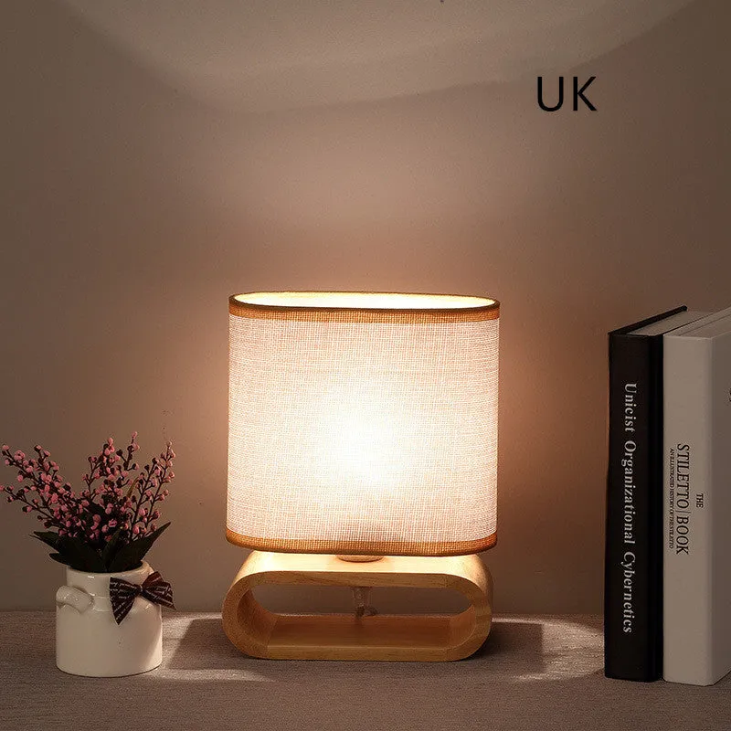 Nordic Japanese bedside table lamp with rubber wood holder, Φ170mm by H230mm, on a nightstand
