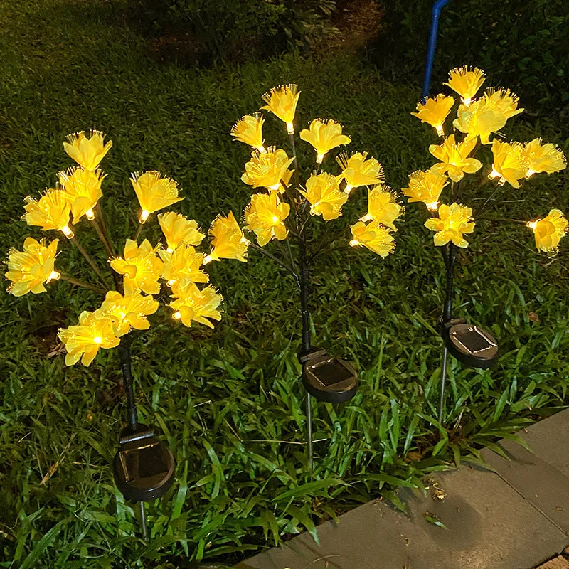 LED solar simulation camellia lawn lamp in garden setting, available in pink or yellow, IP65 rated, 720mm tall