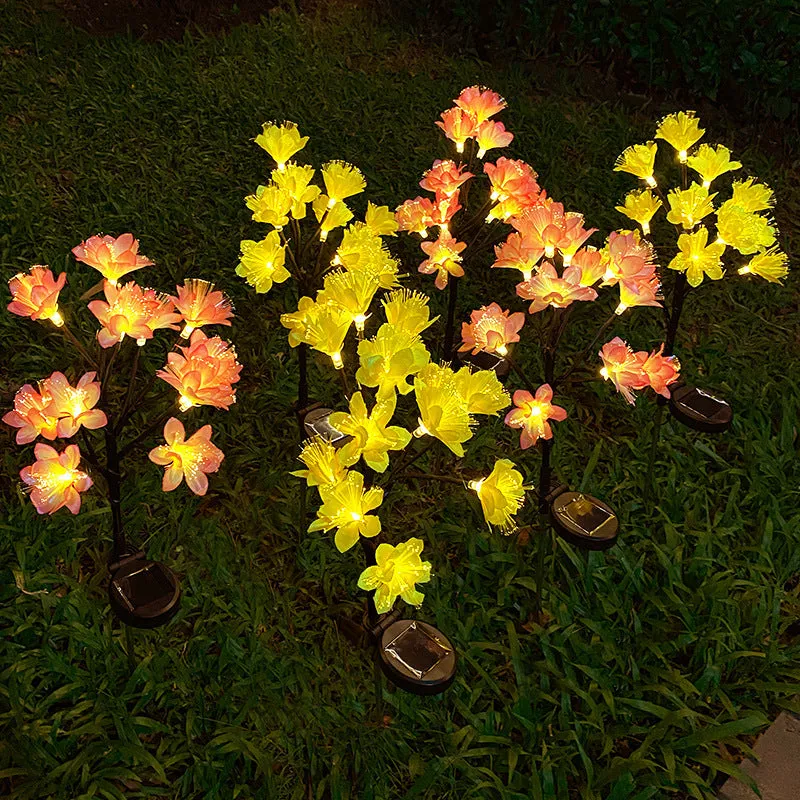 LED solar simulation camellia lawn lamp in garden setting, available in pink or yellow, IP65 rated, 720mm tall