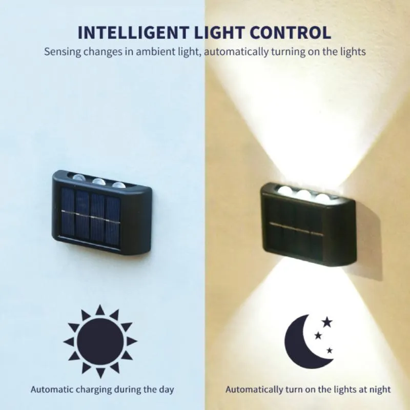 Black solar outdoor garden wall light with up and down glowing effect on a brick wall at night
