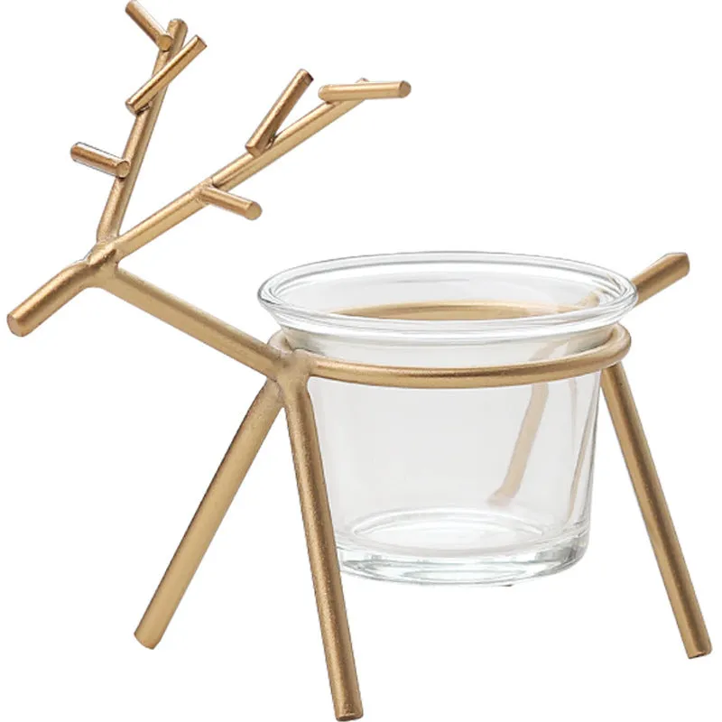 Wrought iron fawn candle holder with glass cup in gold electroplated finish on tabletop
