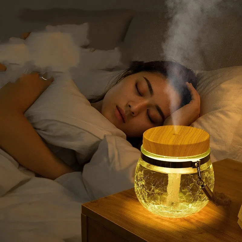 Round desktop USB humidifier in white plastic and glass with heavy fog output