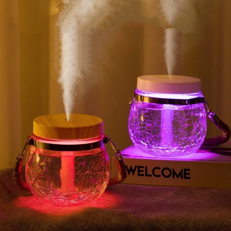 Round desktop USB humidifier in white plastic and glass with heavy fog output