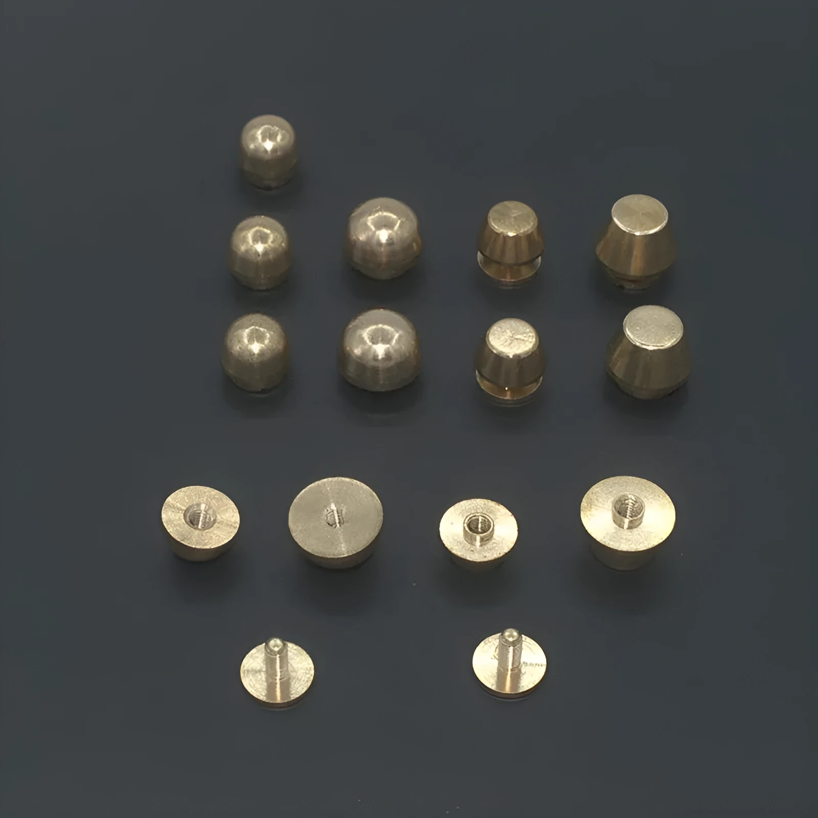 Brass decorative buckle showing round and bucket foot nail styles in 10x6mm and 12x7mm sizes