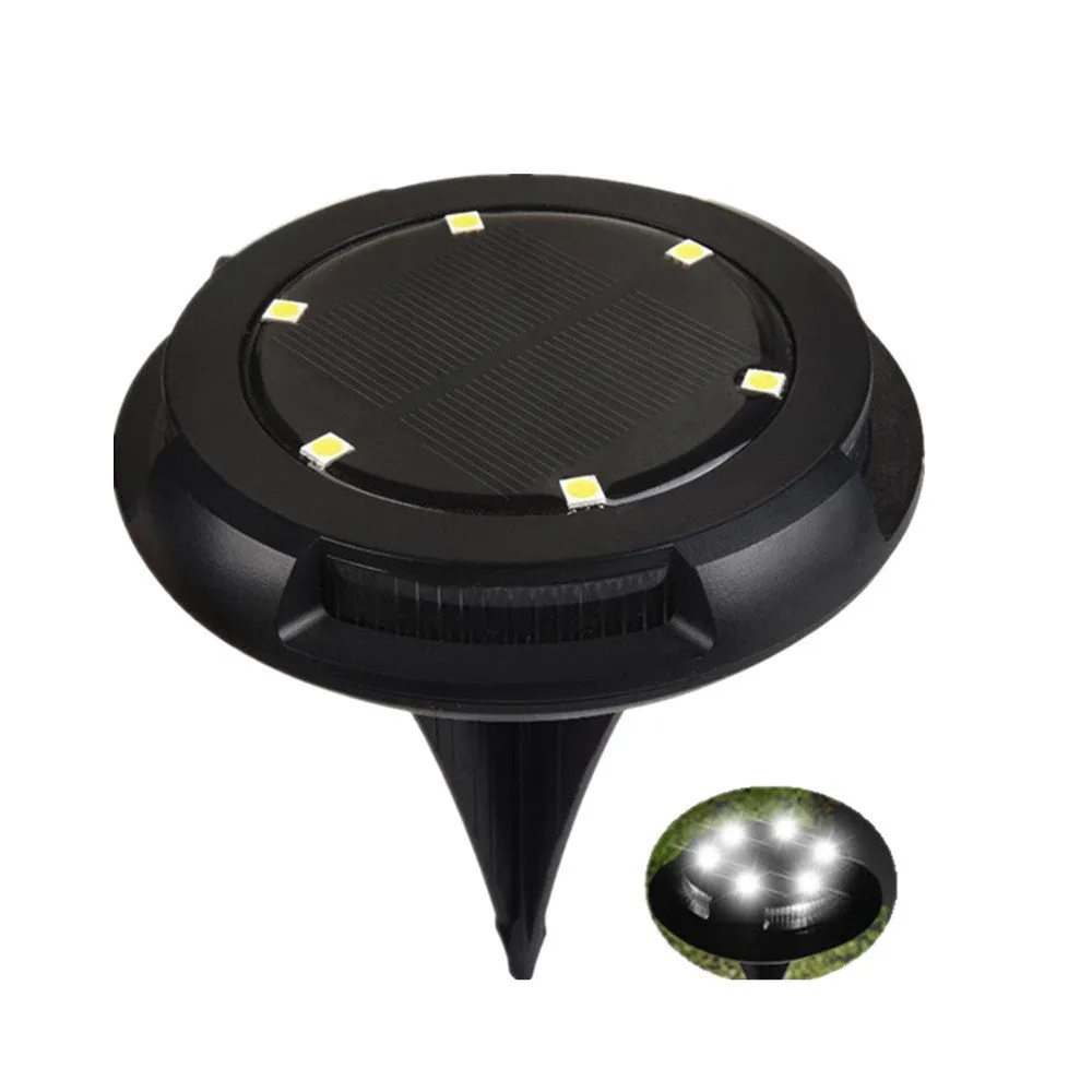 LED solar underground lawn light 11x4x13cm black ABS PP with seven colour changing cold white light on grass at dusk