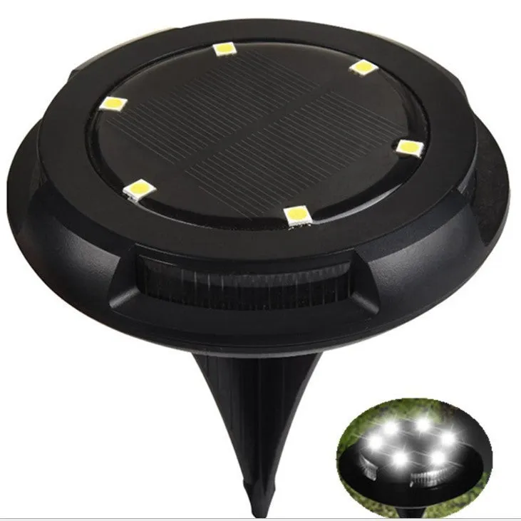 LED solar underground lawn light 11x4x13cm black ABS PP with seven colour changing cold white light on grass at dusk