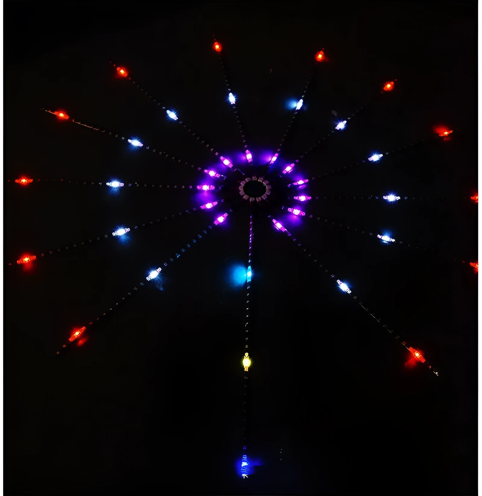 LED voice-activated marquee fireworks light strip with 60 RGB LEDs per metre and 24-key remote controller on a dark background