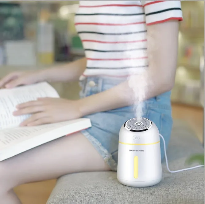 Mini ultrasonic USB humidifier 330ml in blue on desk with fan and LED light