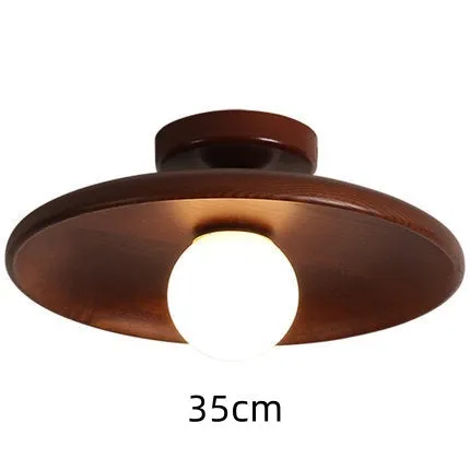Modern minimalist ceiling lamp with solid wood body and glass shade in wood or walnut colour.
