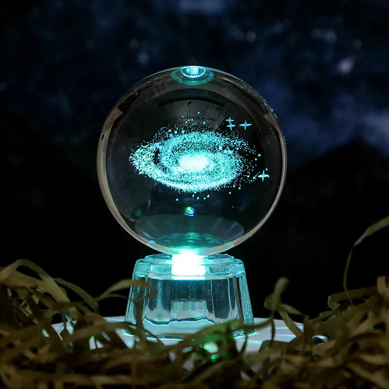 Transparent white crystal ball ornament with inner carving on a fixed base.