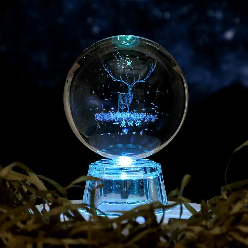Transparent white crystal ball ornament with inner carving on a fixed base.
