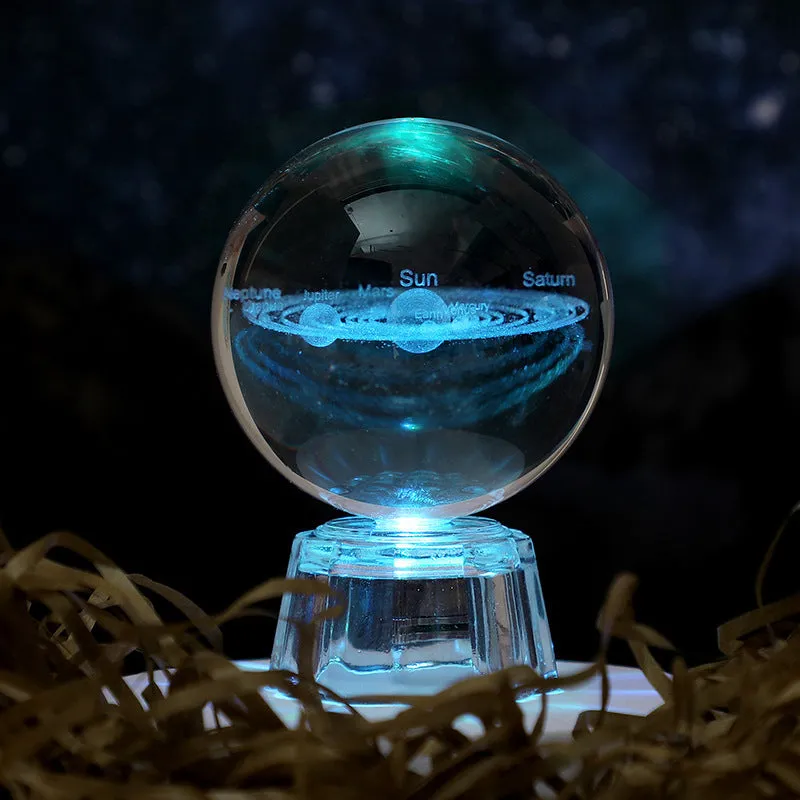 Transparent white crystal ball ornament with inner carving on a fixed base.