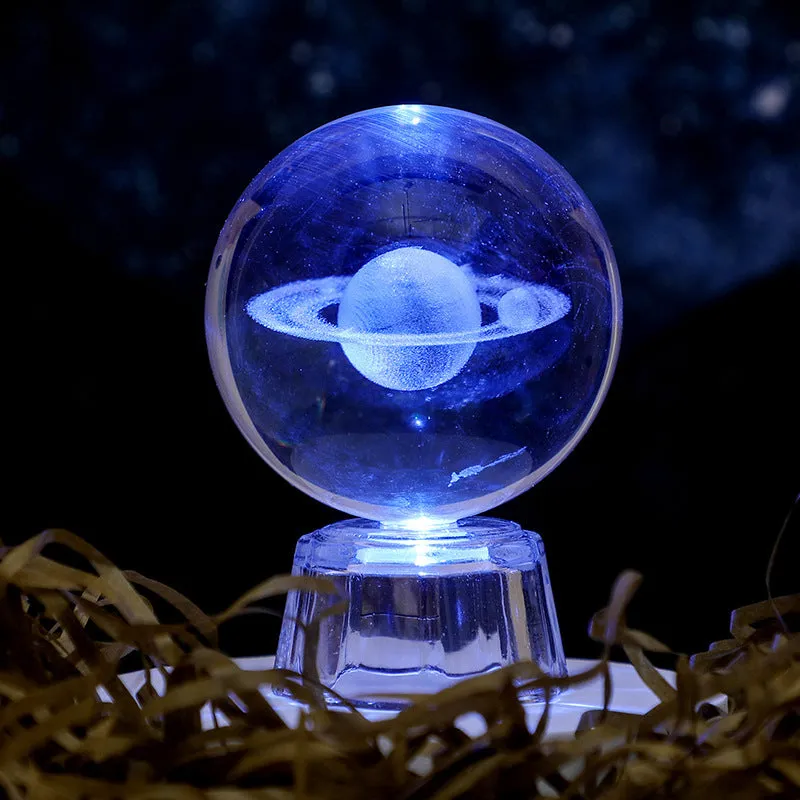 Transparent white crystal ball ornament with inner carving on a fixed base.
