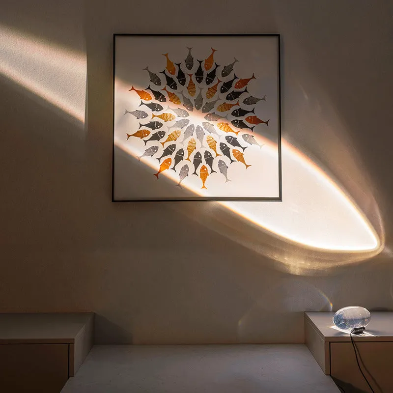 Projection lamp with crystal shade emitting warm LED light on a desk, 160x90 mm