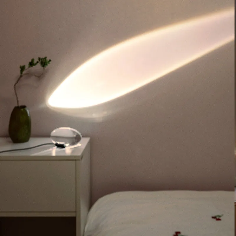 Projection lamp with crystal shade emitting warm LED light on a desk, 160x90 mm