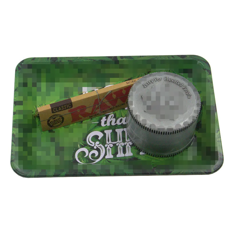 Green metal cigarette tray with maple leaf pattern, 18 x 12.5 cm tinplate ashtray on table
