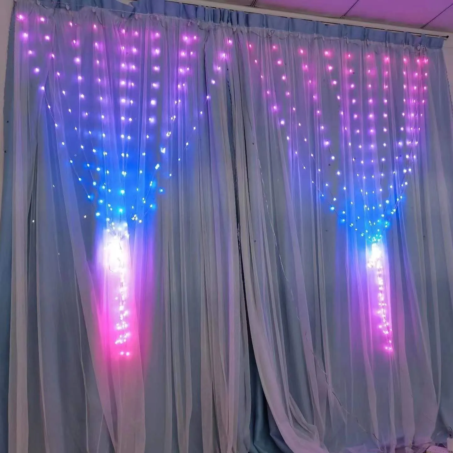 Programmable magic curtain light with 400 LEDs, Bluetooth APP control, and leather wire casing in decorative use