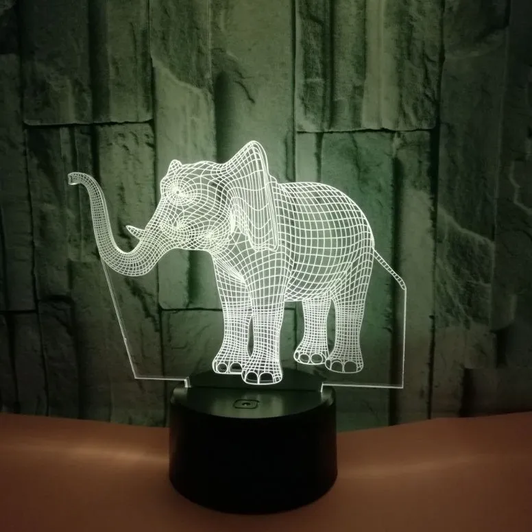 3D LED elephant touch lamp showing seven colour modes on a wooden desk