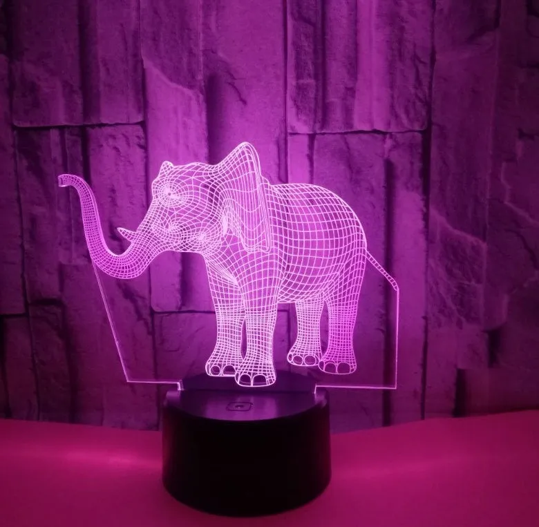 3D LED elephant touch lamp showing seven colour modes on a wooden desk