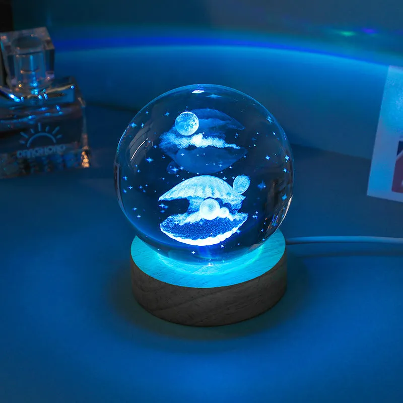 Colorful luminous crystal ball on light wooden base with data cable