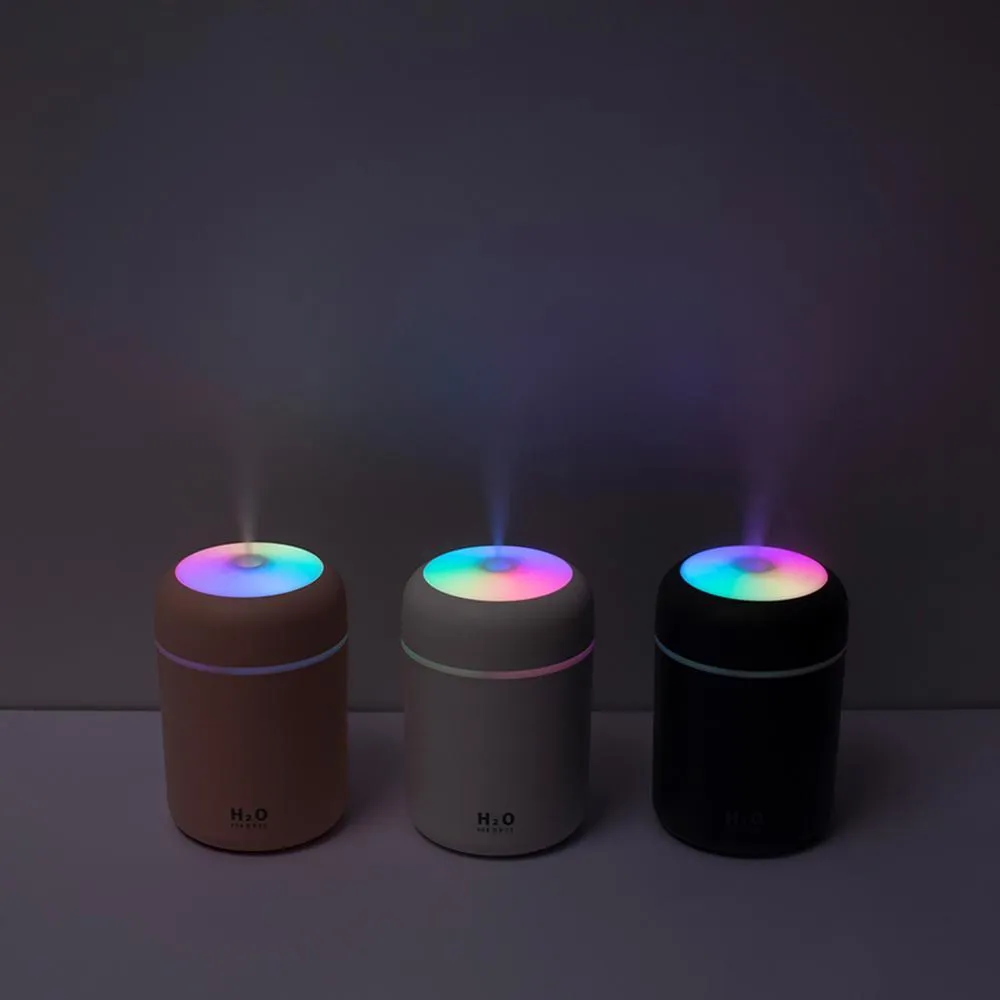 Car USB cup air humidifier with 300ml tank, two spray modes, colourful atmosphere light, in pink colour on desk