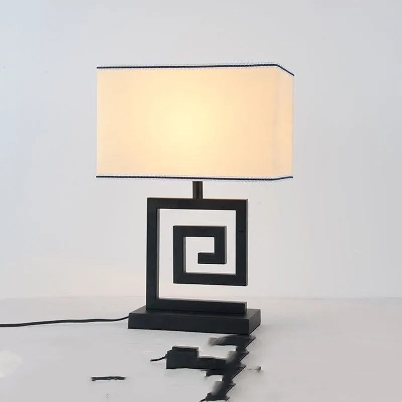 Retro modern Chinese table lamp with fabric lampshade and iron base on wooden side table