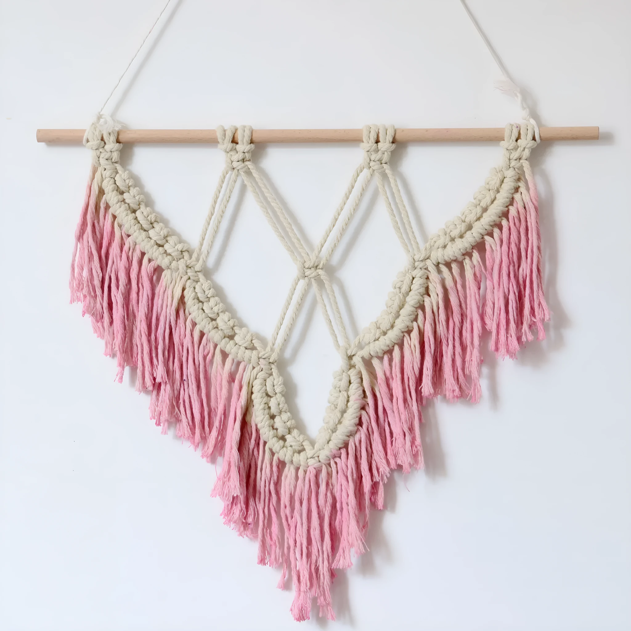 Boho style macrame wall hanging handmade from cotton rope, 40x50cm, pink colour with fringed ends and wooden rod
