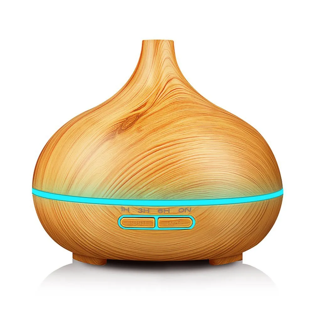 Round 550ml ultrasonic aromatherapy humidifier in white with mechanical control on desk