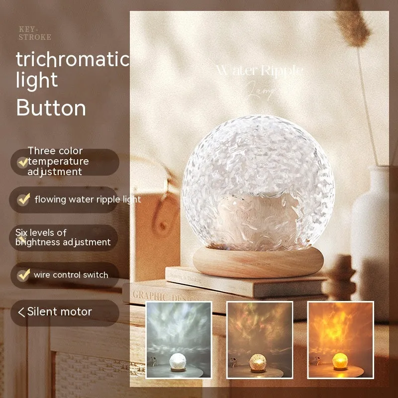 Projector night lamp with water ripple effect and remote control on a bedside table
