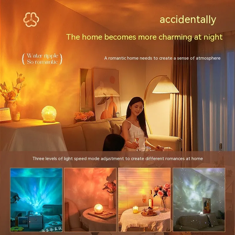 Projector night lamp with water ripple effect and remote control on a bedside table