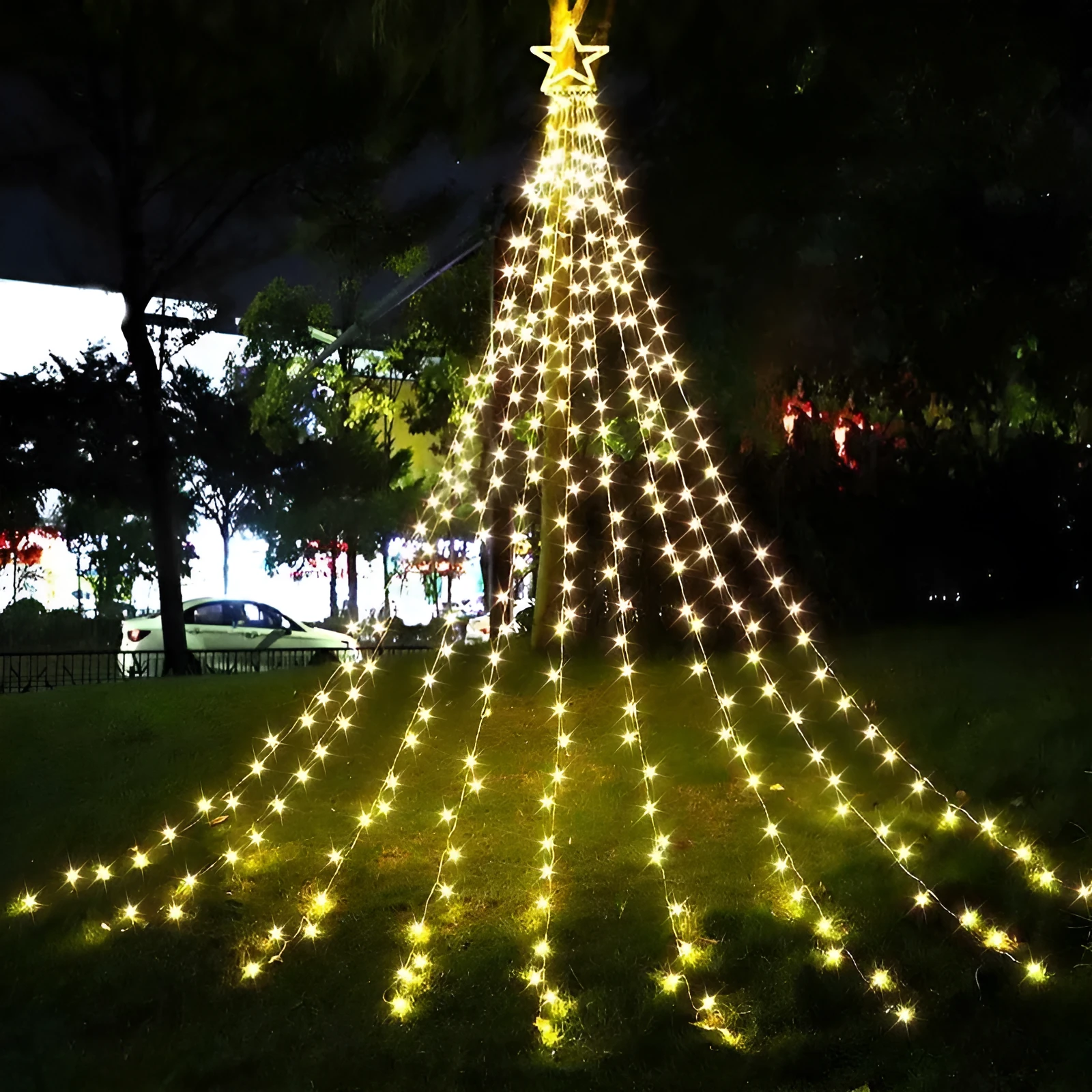 LED five-pointed star waterfall light for outdoor courtyard decoration, 1000mm length, warm white light, on a wooden fence