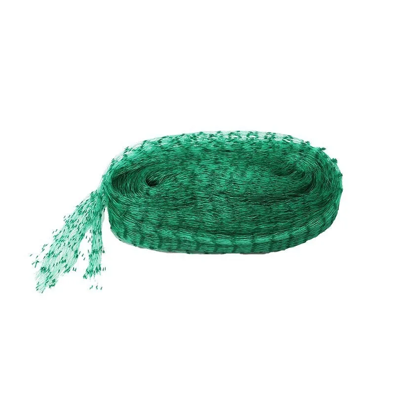 Green polypropylene garden bird net draped over a fruit tree for anti-bird protection