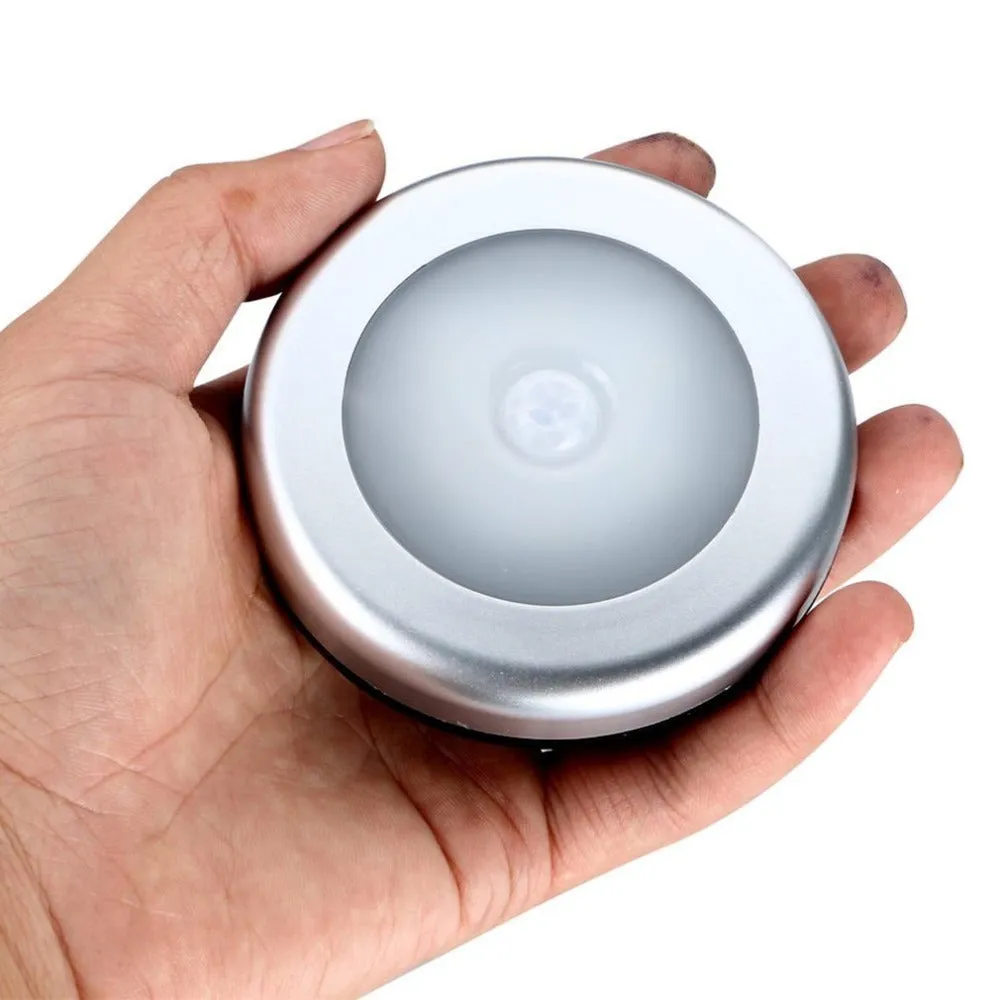 Silver wireless motion sensor night light with square PC plastic shade.
