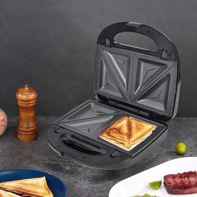 Black double-sided electric sandwich pan with brushed stainless steel lid on kitchen counter