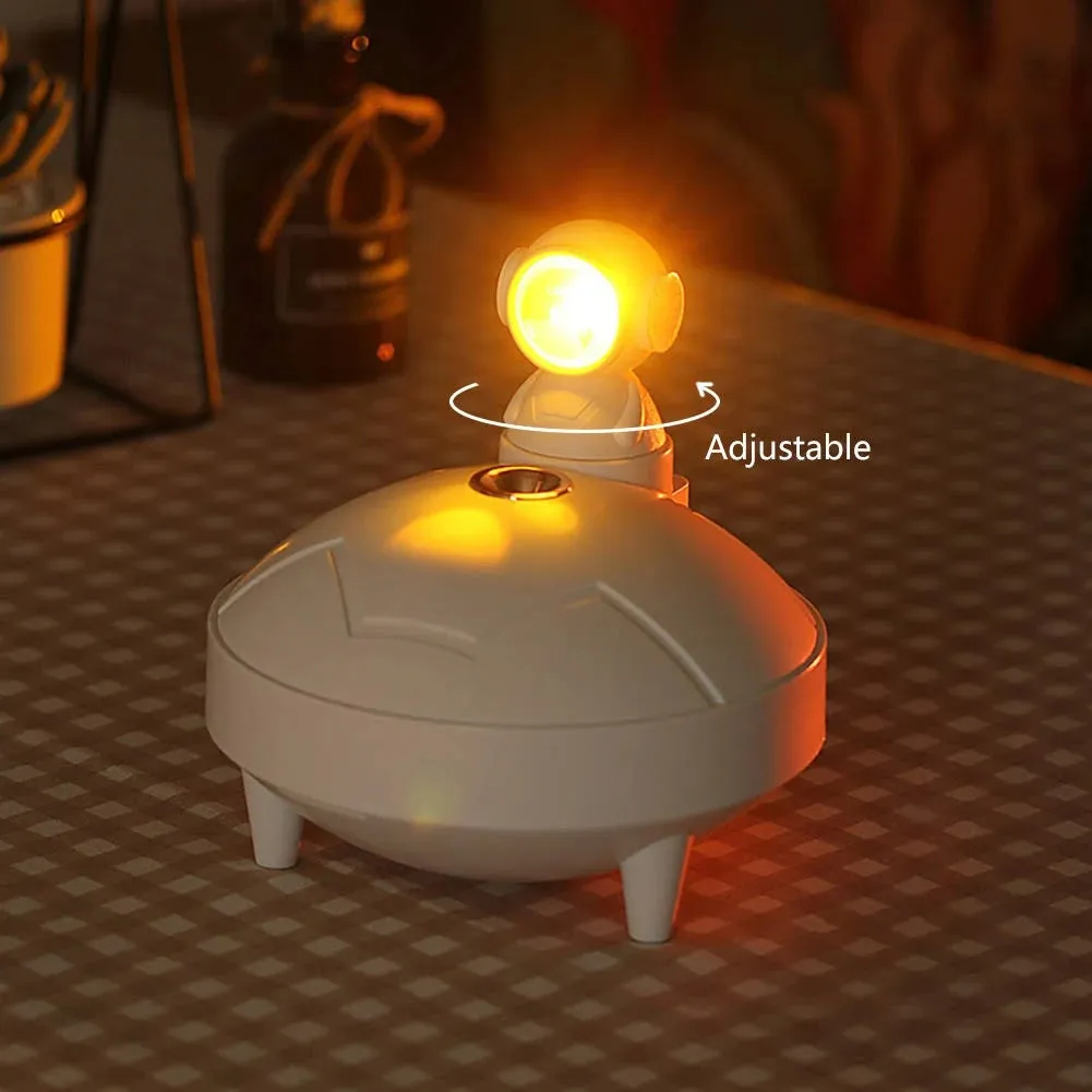 Astronaut sunset lamp humidifier in white with 360-degree rotating head and mist from single fog outlet