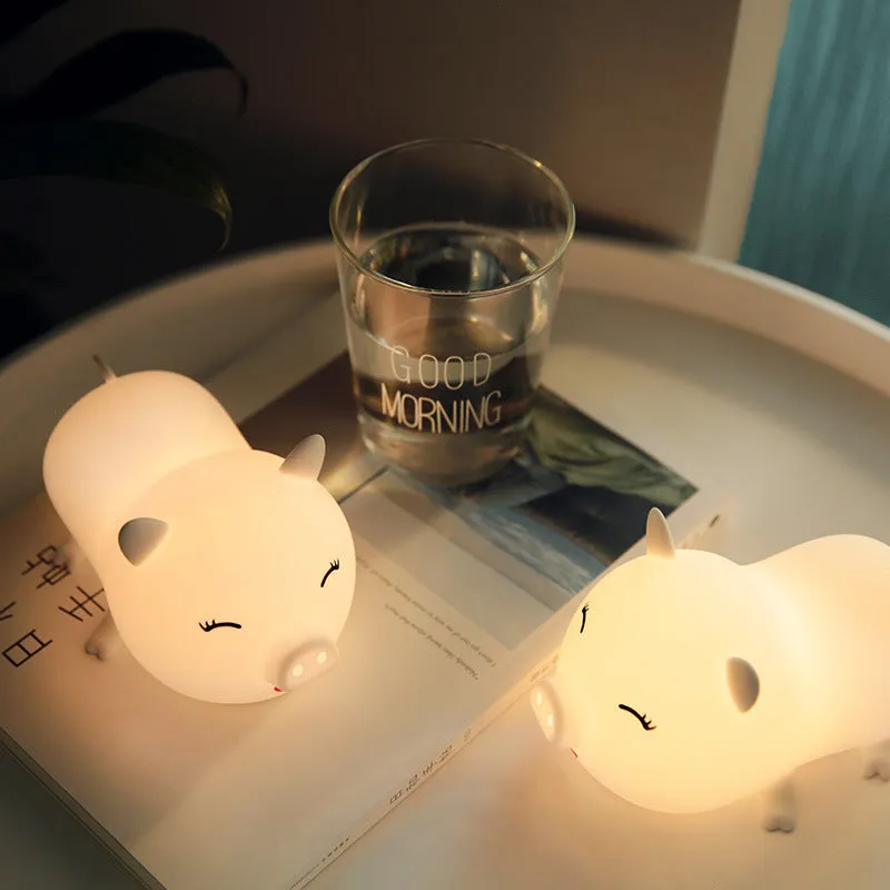 Dudu pig cartoon plastic night light with silicone shade emitting warm yellow and colourful LED glow