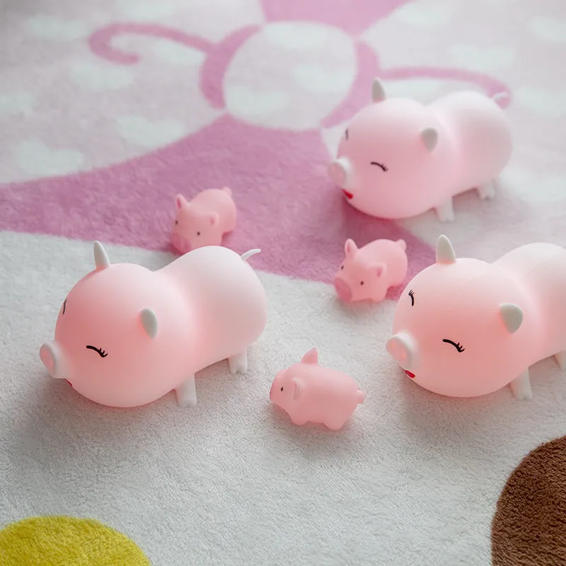 Dudu pig cartoon plastic night light with silicone shade emitting warm yellow and colourful LED glow