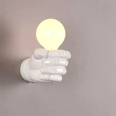 Resin wall lamp shaped like a clenched fist in black, white, or wood grain finish for bar or corridor decoration.