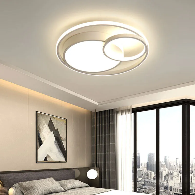 Modern minimalist round LED ceiling light in white with wrought iron frame and acrylic shade.