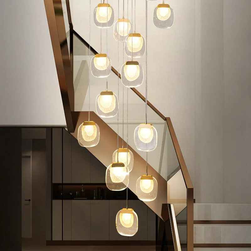 Postmodern crystal chandelier with six gold heads, stainless steel chassis, and adjustable cable on a ceiling